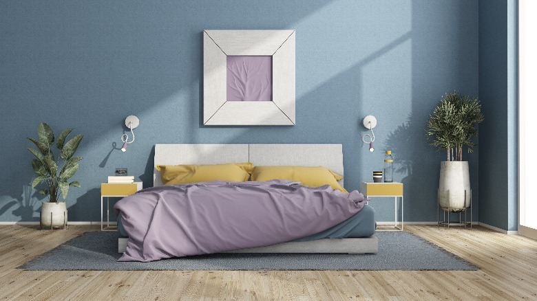 Blue bedroom with purple bedding