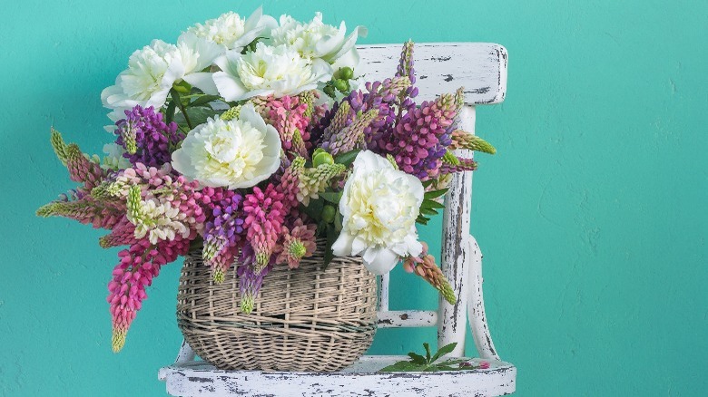 Purple and white flowers on chair