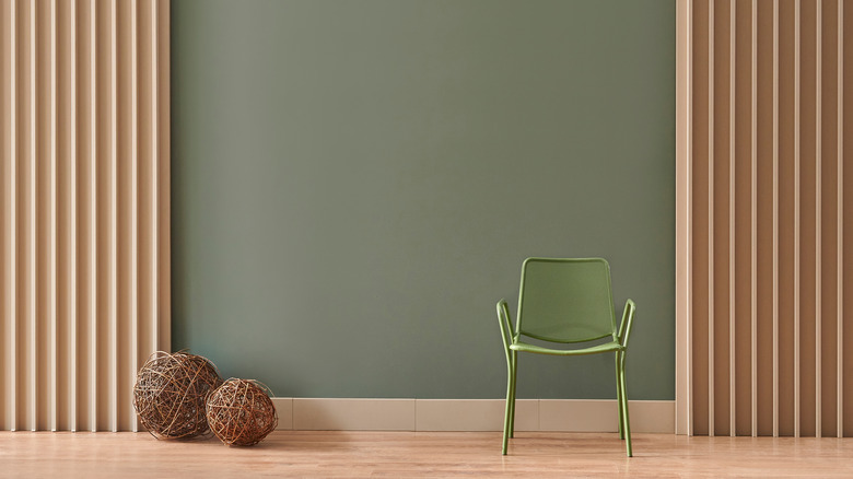 Muted green wall with oak panels