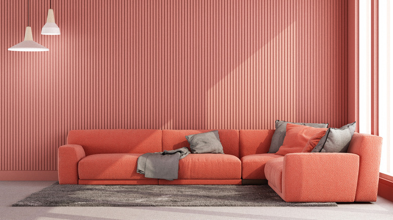 red room with salmon sofa