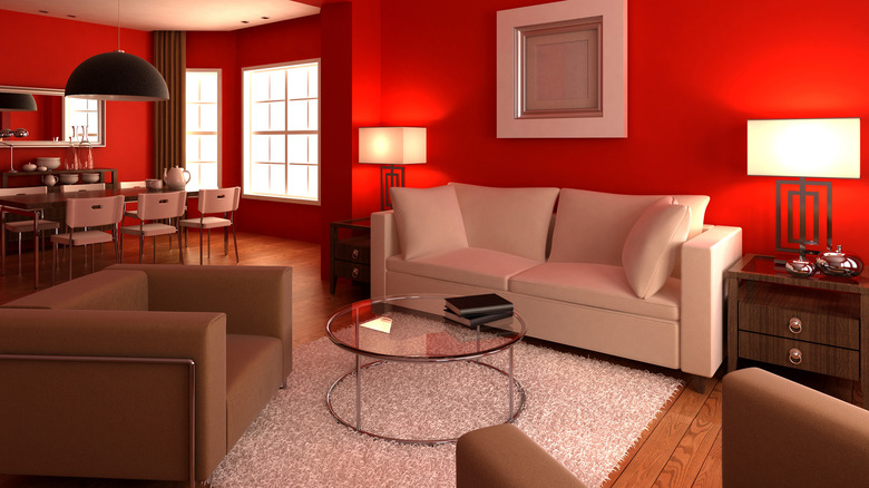 red room with white sofa