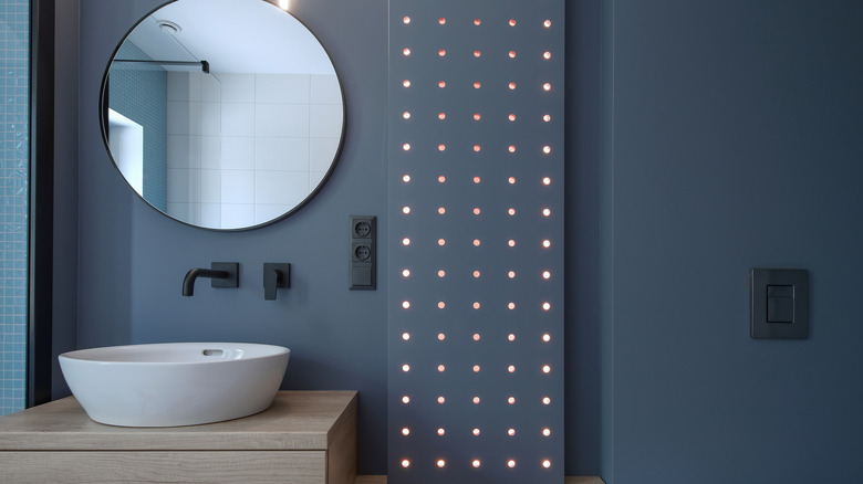 Modern bathroom navy blue wall