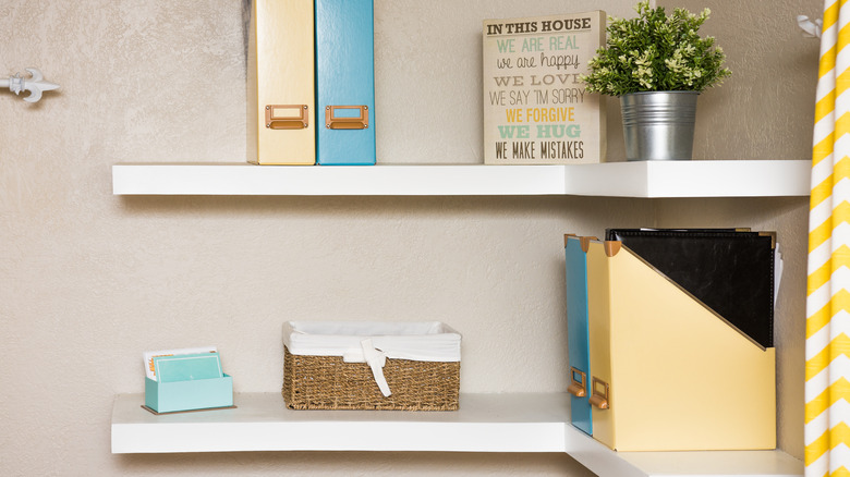 white corner floating shelves