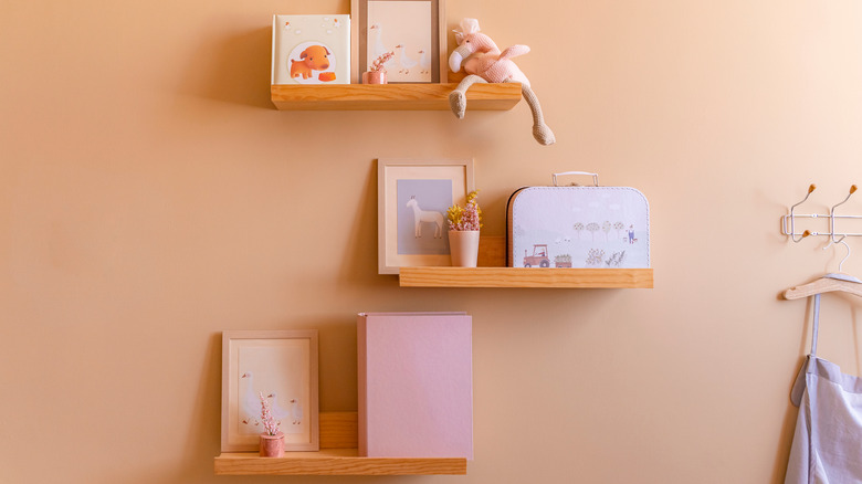 shelves styled with kid's toys