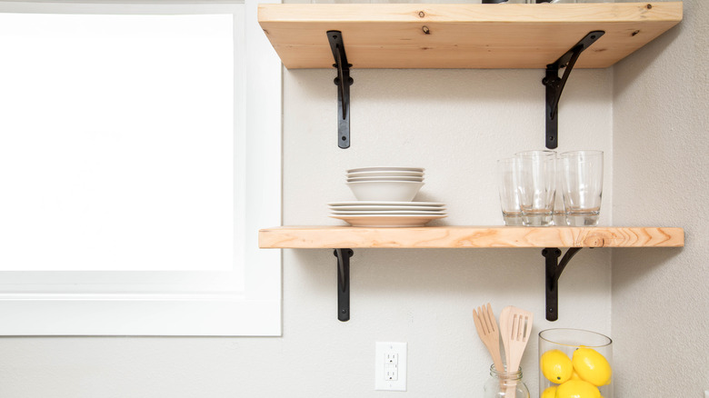 dark brackets with wooden shelves