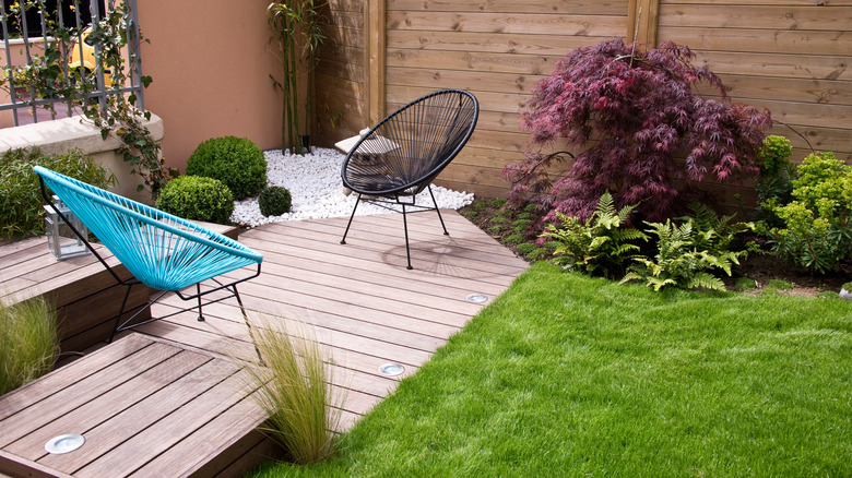 Blue and black chair on a very small patio