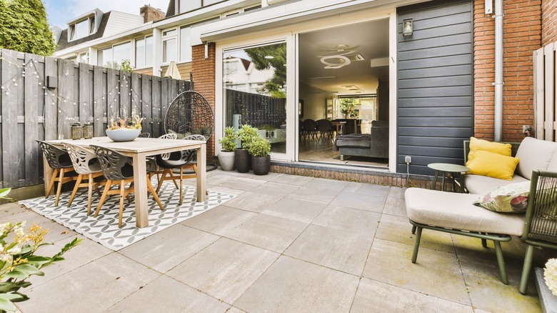 Patio divided in separate zones for dining and relaxing