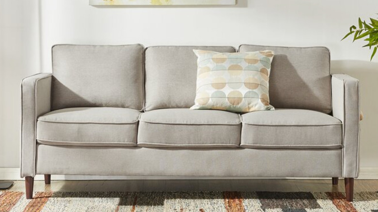 Hana sofa with throw pillow