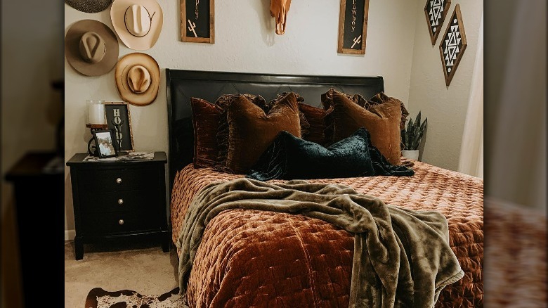 Cowboy hats hanging in bedroom