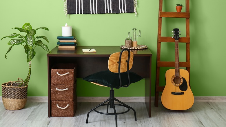 Desk area with guitar