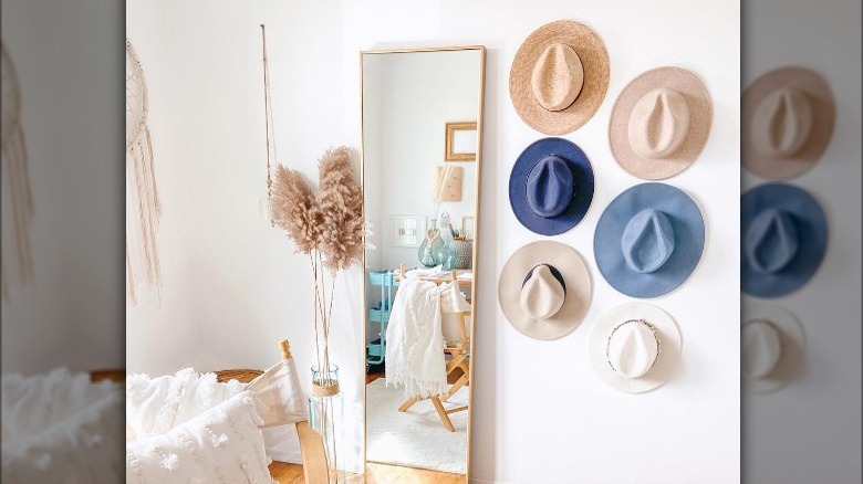 Hats and mirror on wall