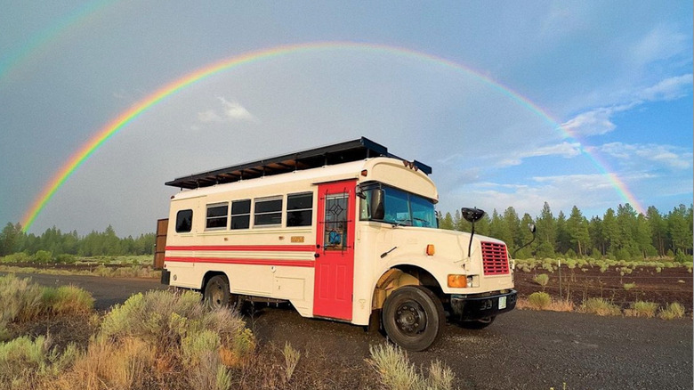 skoolie exterior with rainbow