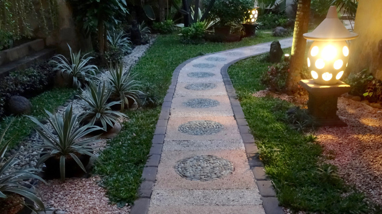 Light by a stone walkway