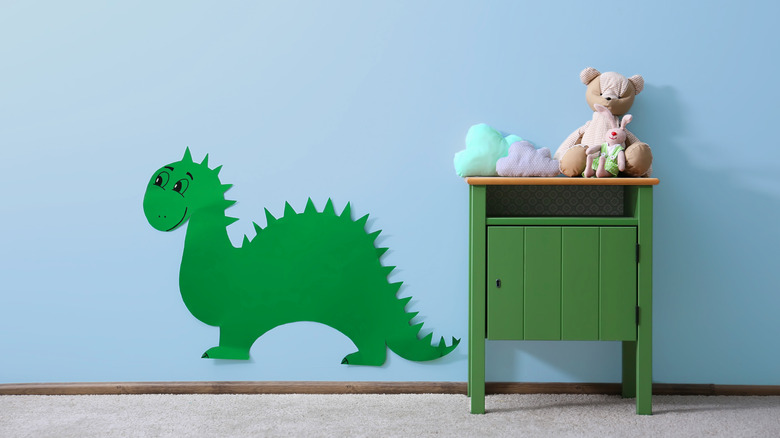 dinosaur on wall in bedroom 