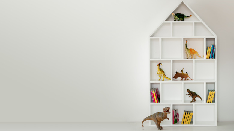 shelf with dinosaurs displayed 