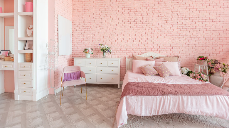 bedroom with pink brick wall
