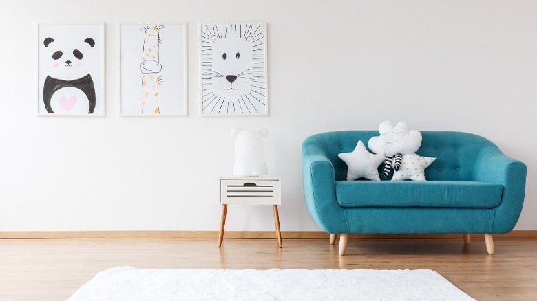 Artwork with turquoise sofa