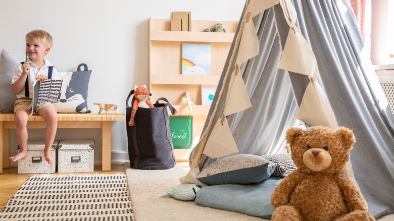 Boy reading in kid's room 