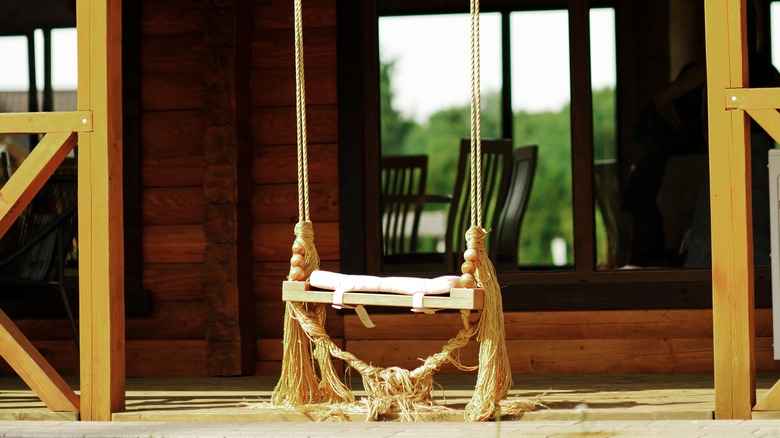 wooden plank swing on porch