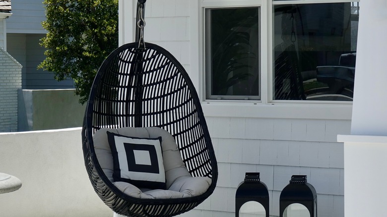 black egg chair on porch