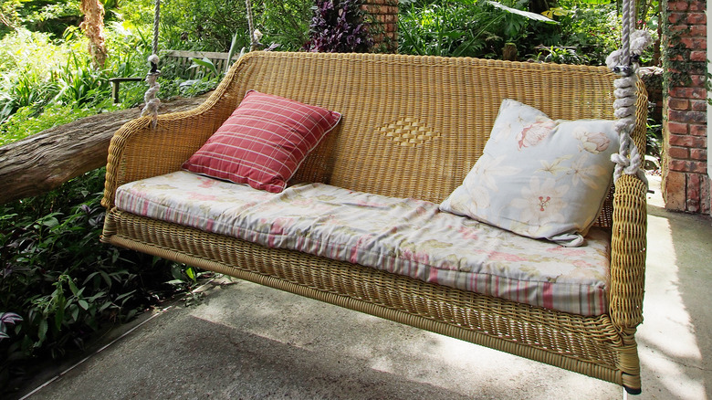 tan woven hanging bench