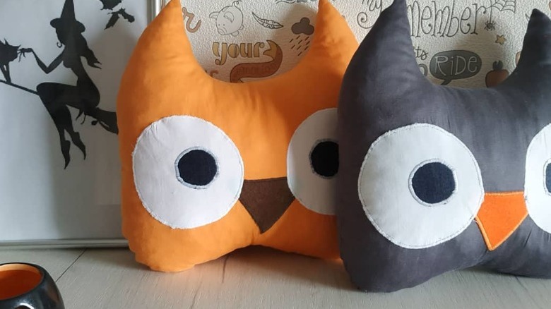 orange and black owl pillows