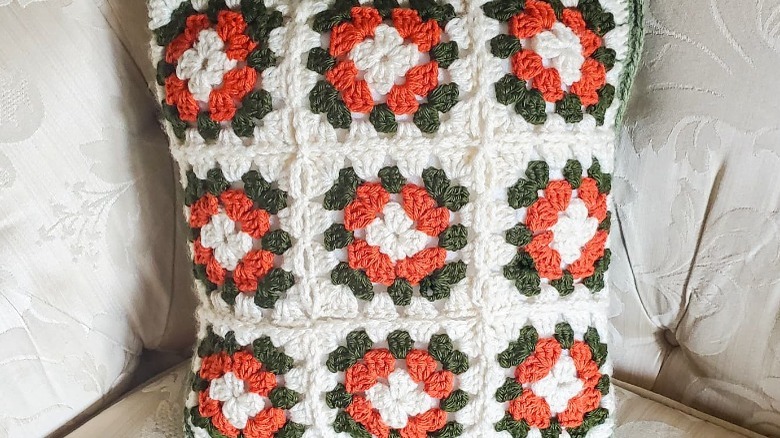 crocheted granny square throw pillow