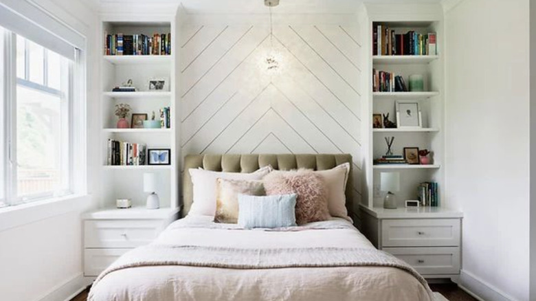 Bed with shelving on each side