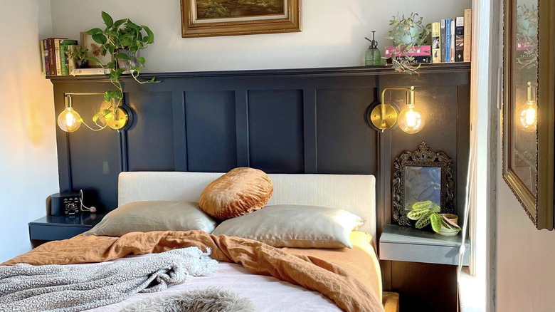 Navy panelling around bed