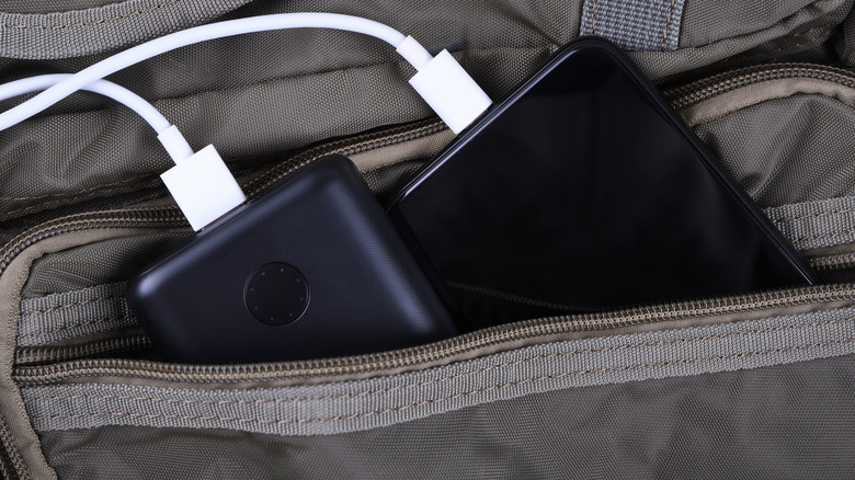 Closeup smartphone cable backpack 