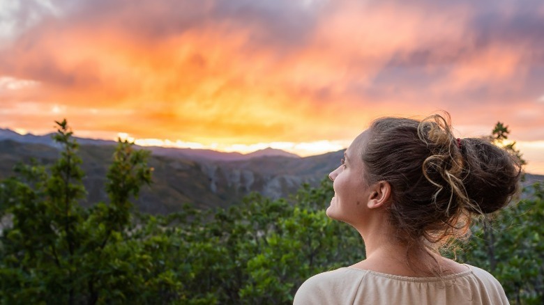 Woman gazing at the sunset