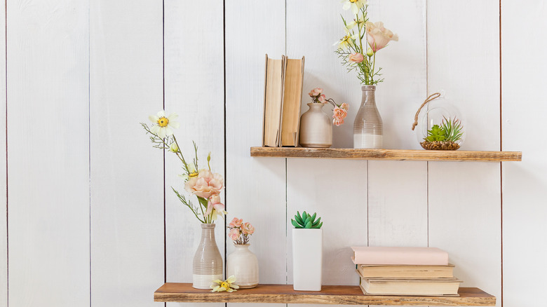 Bookshelf with flower vases