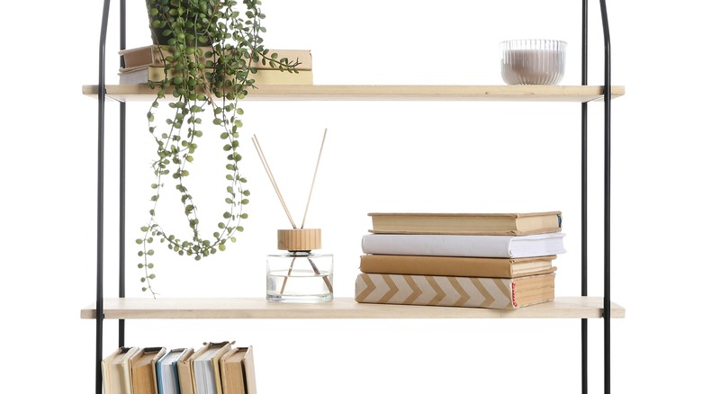 minimalist bookshelf with incense holder