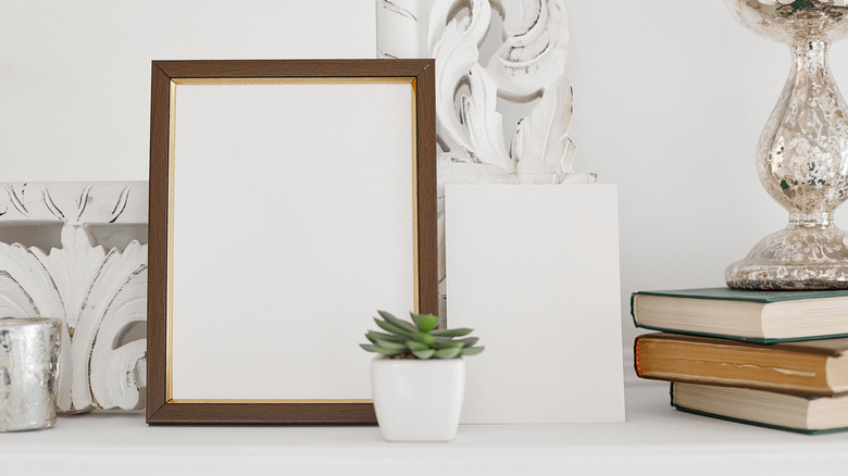 White bookshelf with picture frame