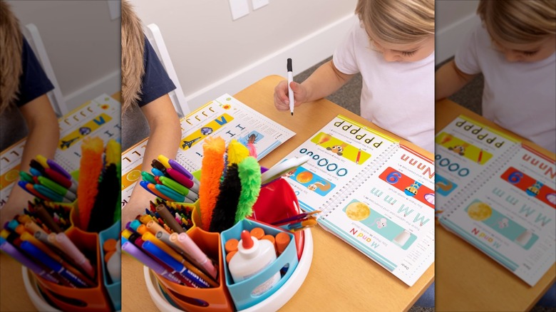 A plastic lazy susan holds craft supplies