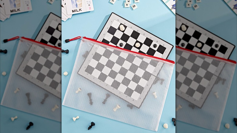 A mesh bag holds a chess set