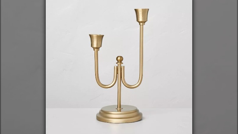 Gold tapered candle holder