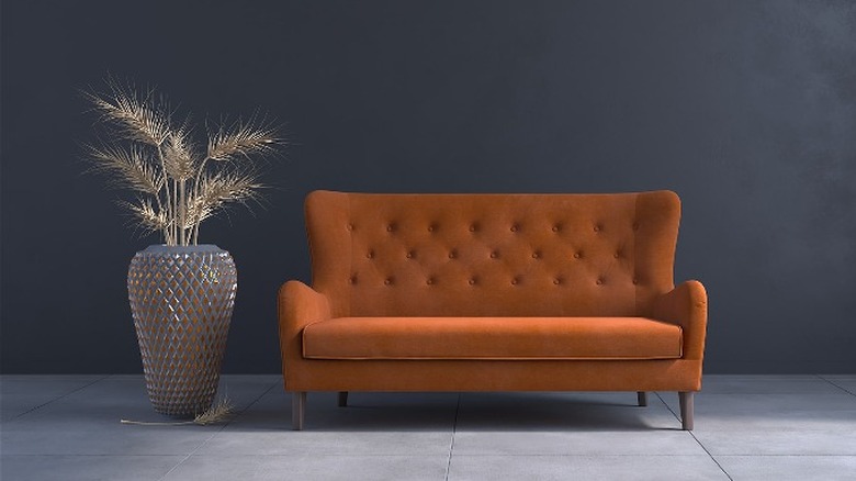 Rust button-tufted settee sofa