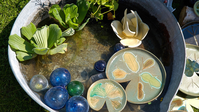 Garden pond made from a metal container