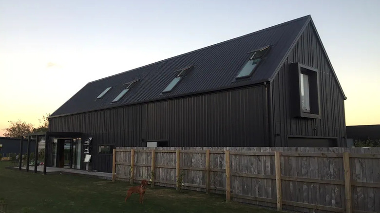 dark barn with a fence