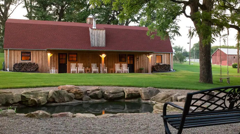 modern barn with a pond