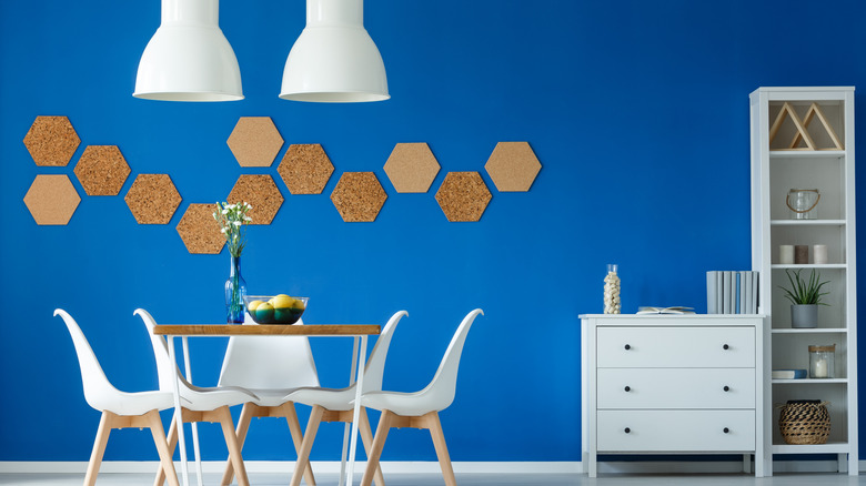 Blue accent wall with corkboards