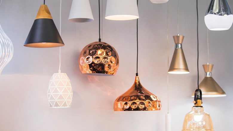 Light fixtures with metallic shades