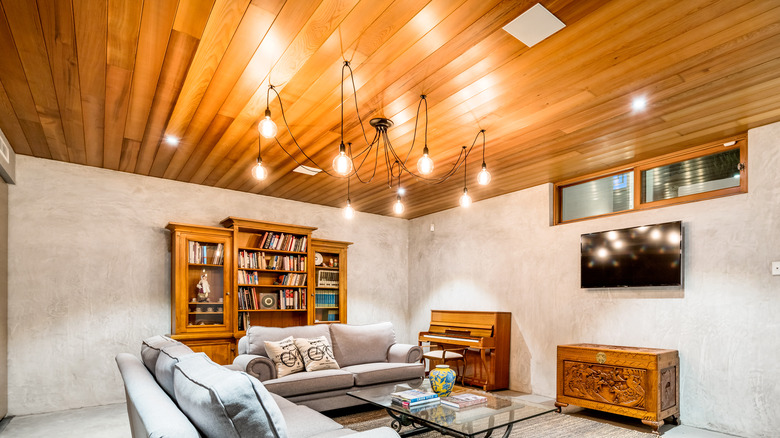 Light wood panel basement ceiling