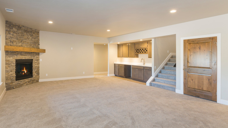 Basement with fireplace and bar