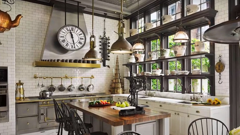 kitchen with clock and kettles