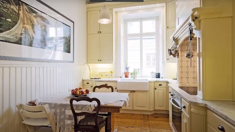 yellow kitchen with wainscotting