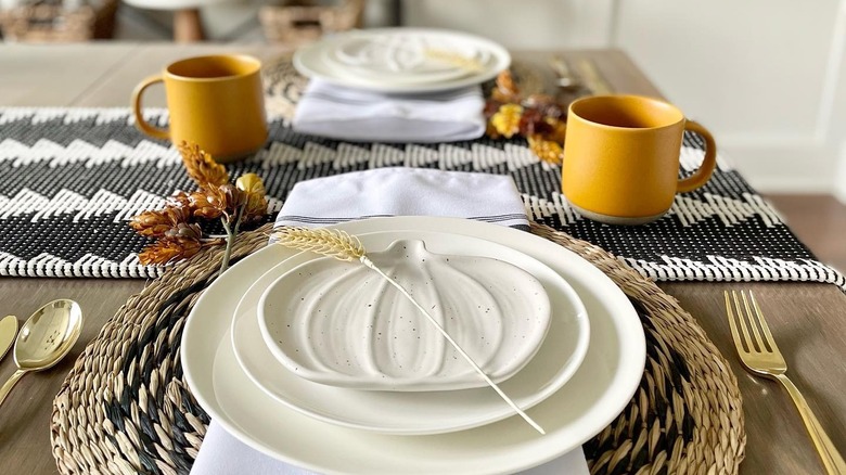 Stacked white plates