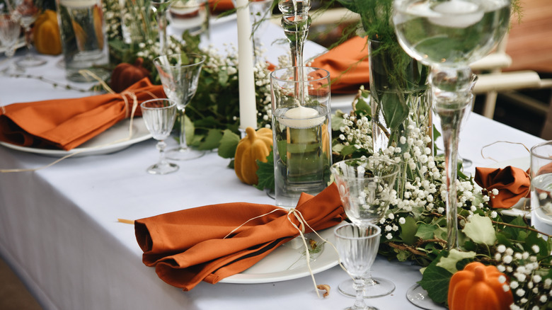 Green, orange, and neutral tablescape