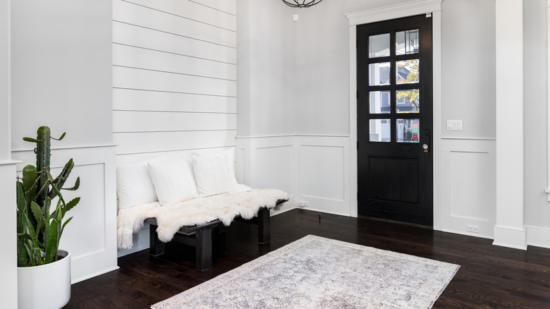 black front door in entryway